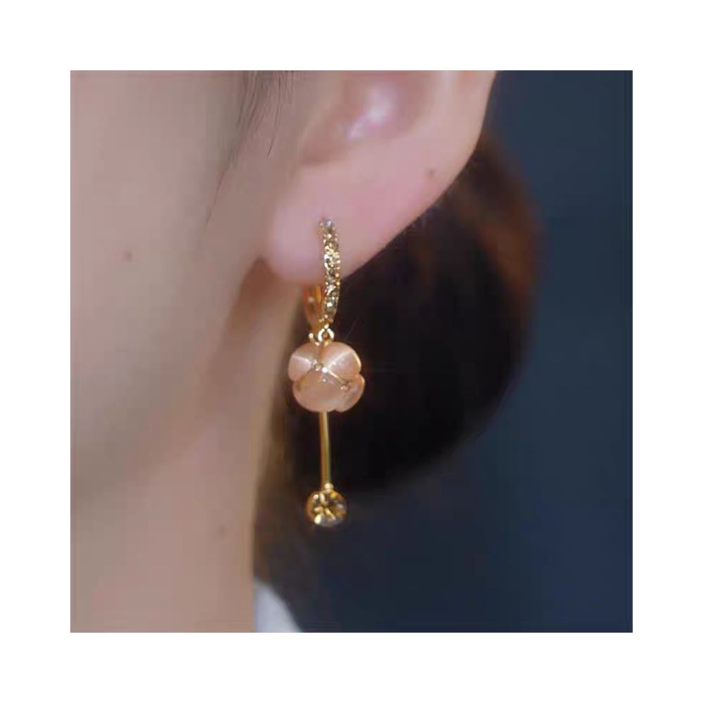 Spring and summer new cat eye stone ball tassel earrings for women with a high end feel micro inlaid ear buckles light luxury temperament face slimming earrings image 2