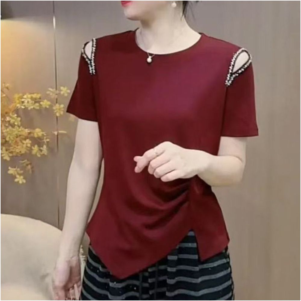 This stylish new summer T shirt features a unique design with hollowed out beading details making it a youthful and flattering base layer It s also a versatile and slimming option image 0
