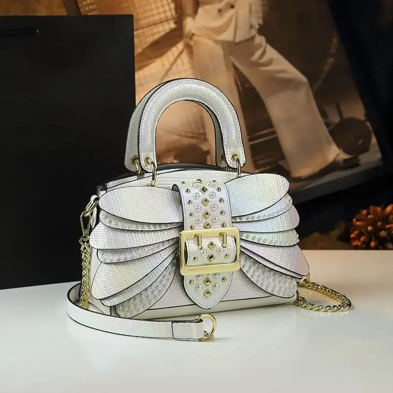 2025 new riveted wing hand-held women's bag, colorful chain crossbody single-shoulder dinner buns mother bag