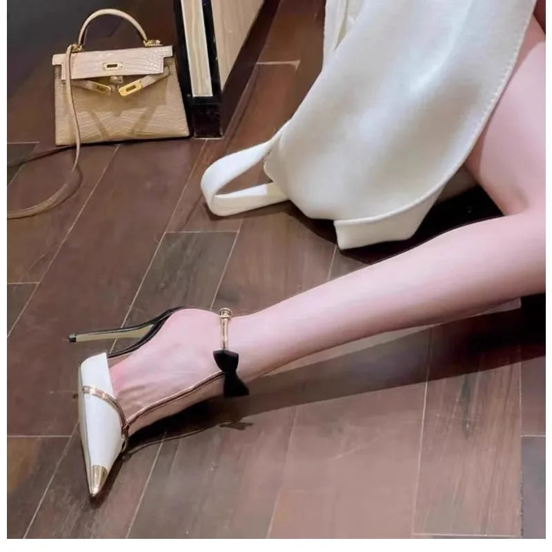 High heeled women's 2025 new hollow pointed color blocked niche butterfly bow metal toe cap straight strap thin heel sandals